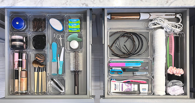 Drawer organizers in various sizes organizing a bathroom drawer
