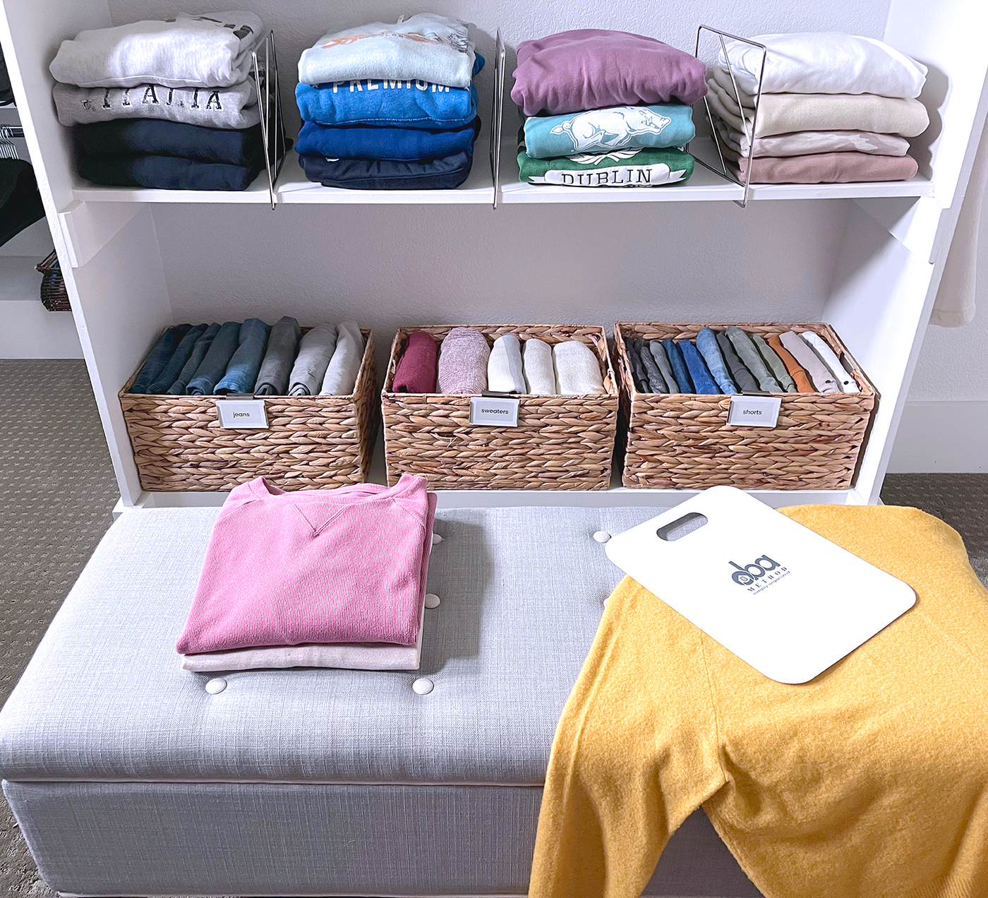 Clothes folded with Perfect Fold Board and stacked in organizing bins